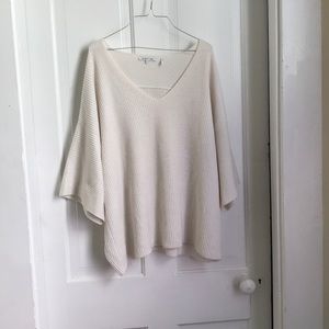 Large white/cream knit material sweater